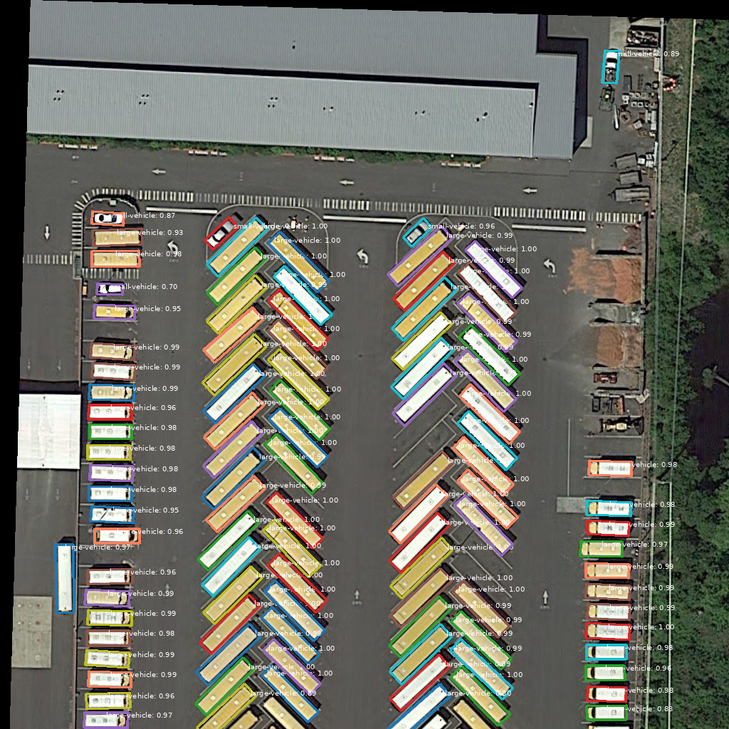 Oriented R-CNN 1× on the DOTA bus lot — one box per vehicle.